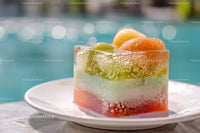 Colorful Fruit Cocktail with Citrus and Ice Cubes by the Pool