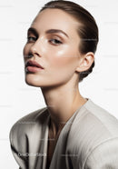 Elegant Woman with Flawless Skin and Soft Makeup Portrait