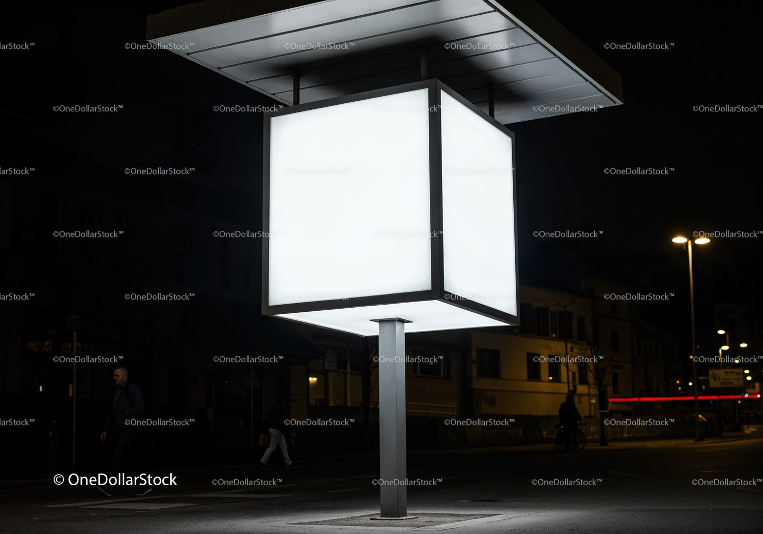 Illuminated cube light fixture on city street at night