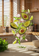 Fresh avocado and greens splashing in kitchen light