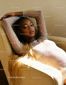 Relaxed woman with shimmering makeup reclining on chair