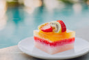 Colorful Fruit Dessert with Strawberries and Kiwi on White Plate