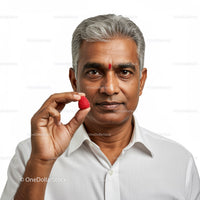 Senior Man Holding Ripe Raspberry in Nostalgic Portrait