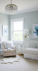 Bright and Cozy Baby Nursery with White Armchair and Floral Decor