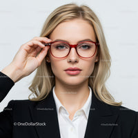 Stylish Blonde Woman Wearing Red Glasses in Business Attire