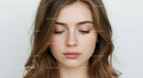 Close-Up of Young Woman with Soft Expressions and Natural Makeup