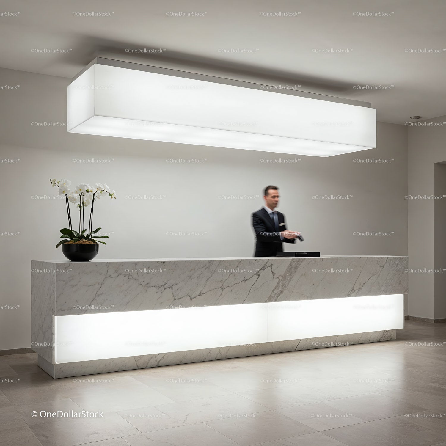 Modern marble reception desk with ambient lighting