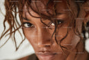Close-up Portrait of a Woman with Curly Hair and Glistening Skin