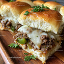 Warm Baked Bread Roll with Ground Beef Cheese and Fresh Herbs