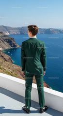 Man in Green Suit Overlooking Scenic Coastal Cliffs