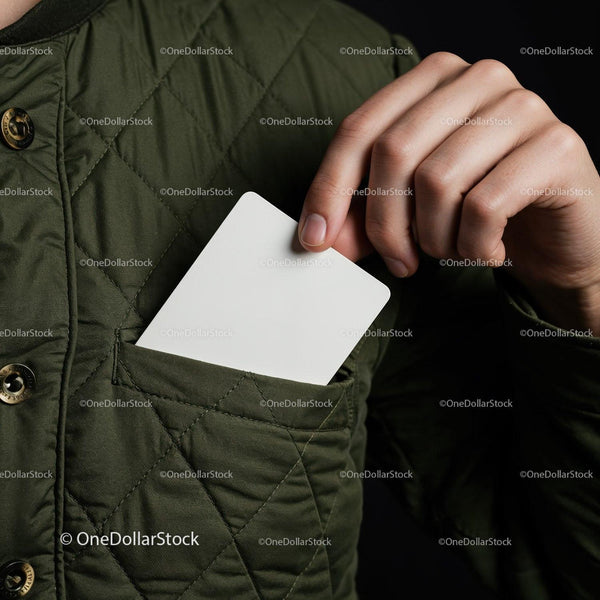 Hand Placing Blank Card into Quilted Green Jacket Pocket JPG Mockup Image