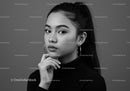 Elegant Black and White Portrait of a Young Woman with Hoop Earrings