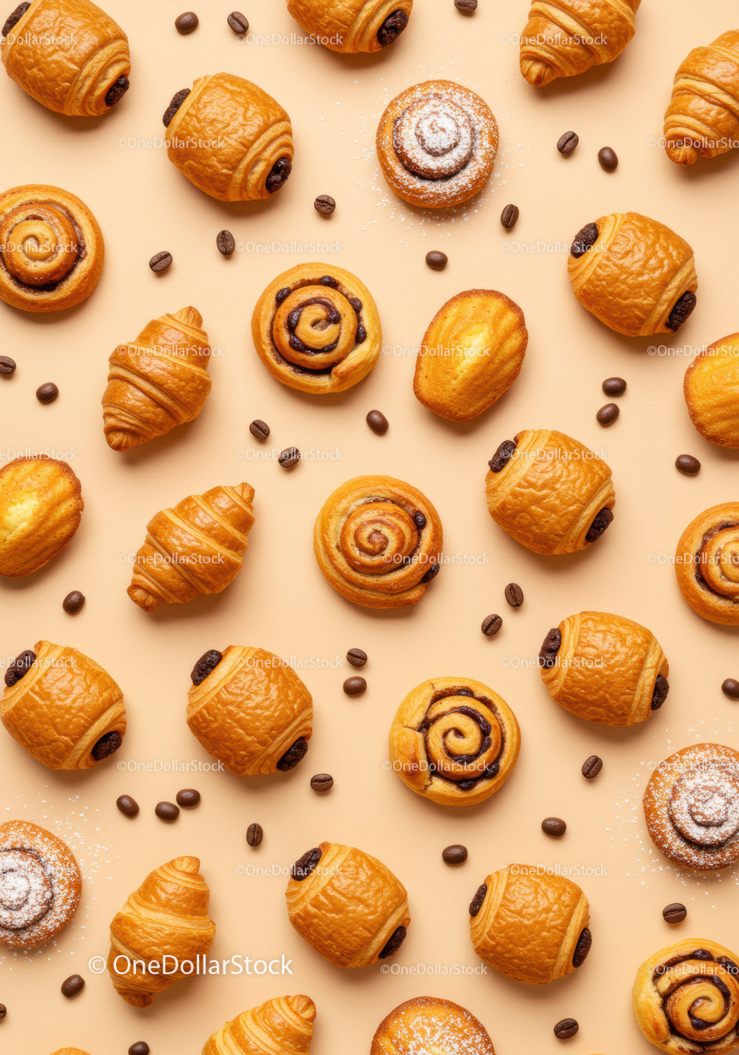 Assorted French Pastries and Coffee Beans on Beige Table