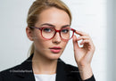 Elegant Woman Wearing Red Glasses With Blue Eyes and Blonde Hair