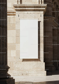 Blank white banner on historic stone building facade