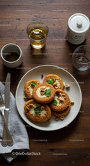 Golden millet pancakes garnished with nuts and herbs