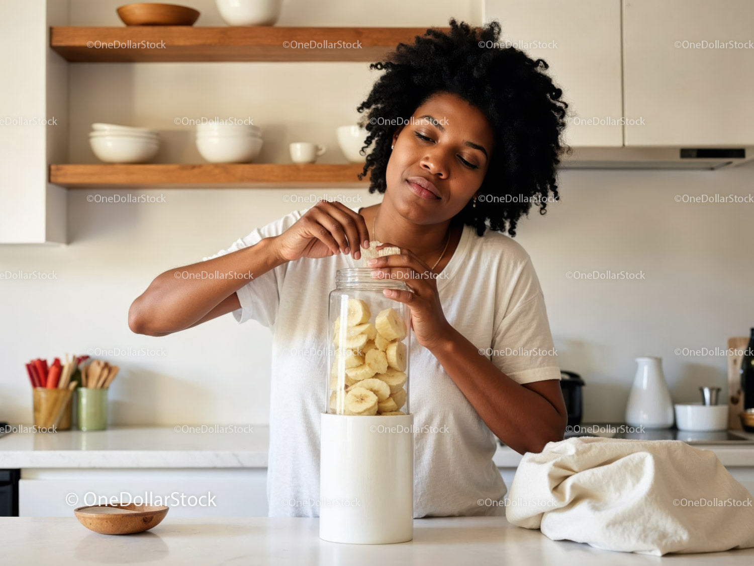 Woman Preparing Fresh Banana Slices in Modern Kitchen