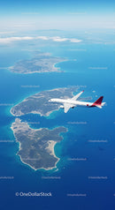 Aerial View of Blue Ocean and Islands with Modern Airplane in Flight