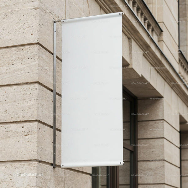 Blank white banner hanging on classic stone building JPG Mockup Image