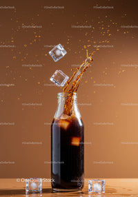 Refreshing Soda Splash with Ice Cubes in Glass Bottle