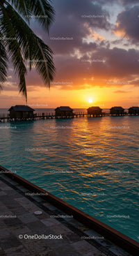 Tropical Sunset Over Water Bungalows and Calm Ocean Scene