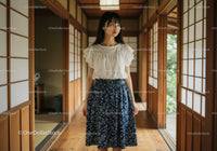 Young Woman in Floral Skirt and White Top in Japanese Interior