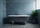Classic clawfoot bathtub in modern blue tiled bathroom