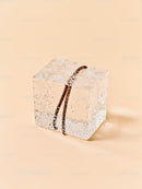 Vanilla bean frozen inside melting ice cube