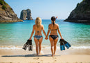 Two Women in Bikinis with Diving Fins Walking on Tropical Beach