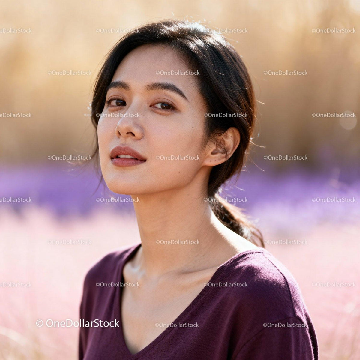 Calm young woman enjoying soft natural sunlight outdoors