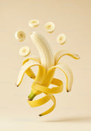 Peeled banana with floating slices and spiral peel