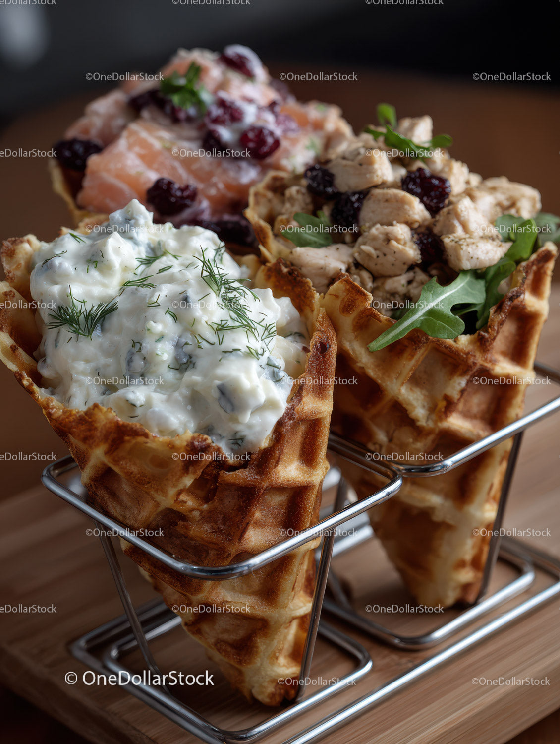 Three Waffles with Chicken Salad Salmon and Berry Topping