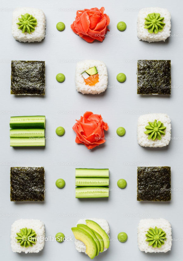 Creative sushi arrangement with fresh vegetables and wasabi