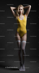 Confident Model in Yellow Swimsuit and Thigh-High Socks