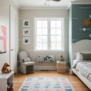Bright Children's Bedroom with Colorful Rug and Playful Decor
