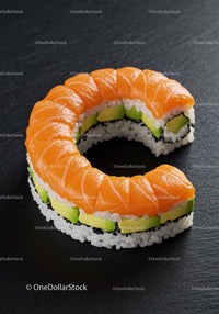 Fresh salmon avocado sushi roll on dark background