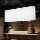 Modern workspace with focus under bright hanging light