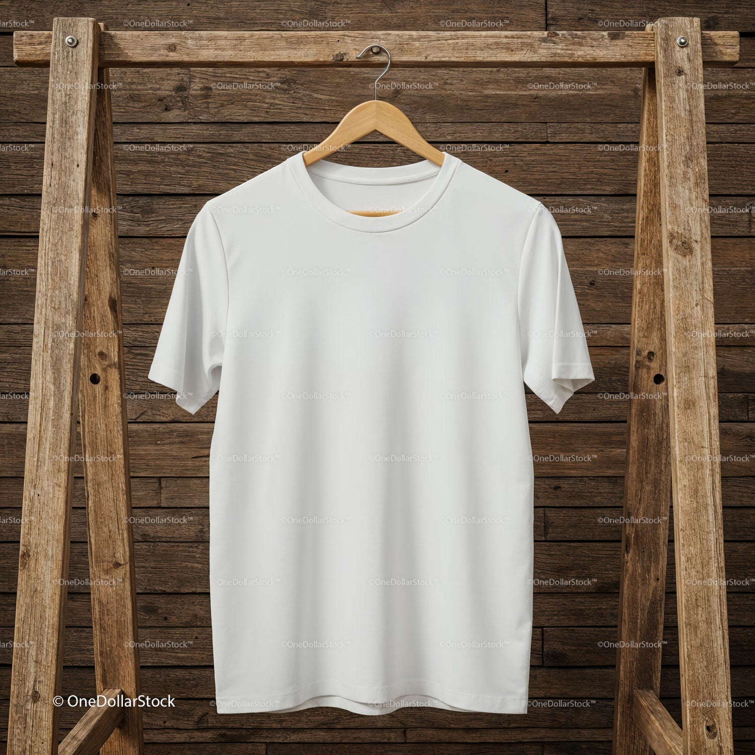 Plain white t-shirt hanging on rustic wooden rack