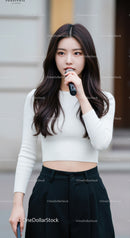 Confident Young Woman Speaking Into Microphone in Urban Setting