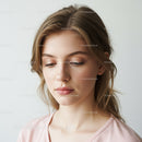 Elegant Woman with Natural Makeup and Soft Expression for Beauty Portrait