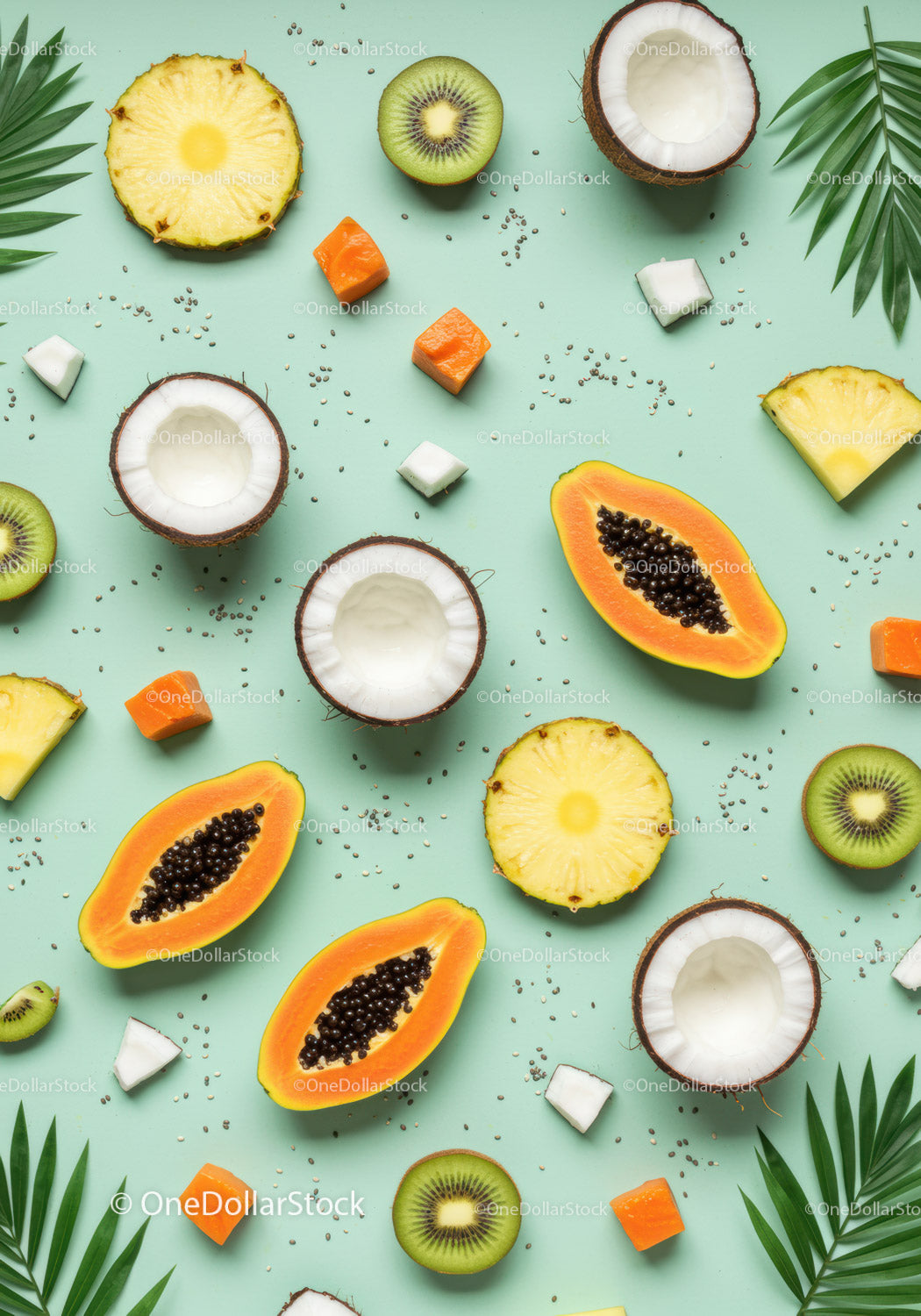 Fresh tropical fruits arranged on pastel background
