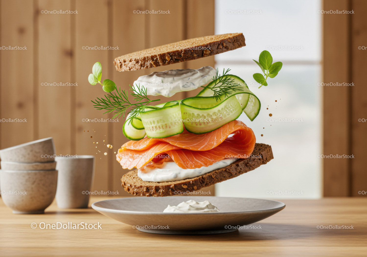 Fresh salmon sandwich with cucumber and herbs floating