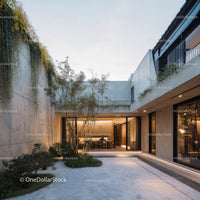 Modern minimalist villa with lush courtyard and sleek glass doors