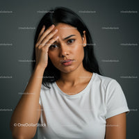 Confused Young Woman with Scratching Head in Indoor Portrait