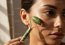 Close-Up of Young Woman Using Jade Roller for Facial Massage