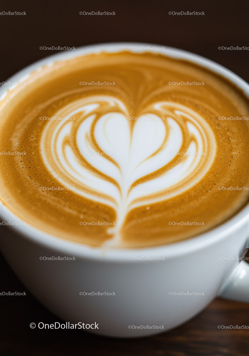 Latte art heart design in white coffee cup
