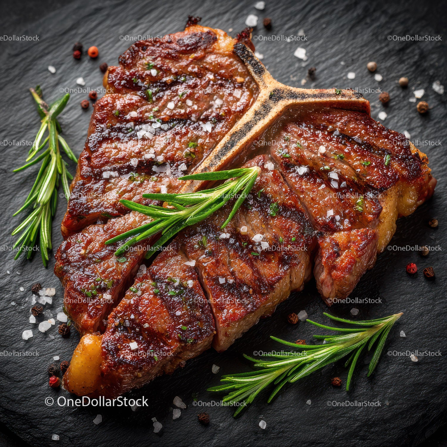 Juicy Grilled Steak with Herbs and Seasonings on Slate Surface
