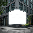 Blank illuminated billboard on modern urban street corner