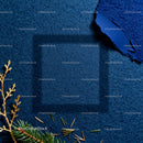 Cozy shadows on textured blue fabric with pine twigs
