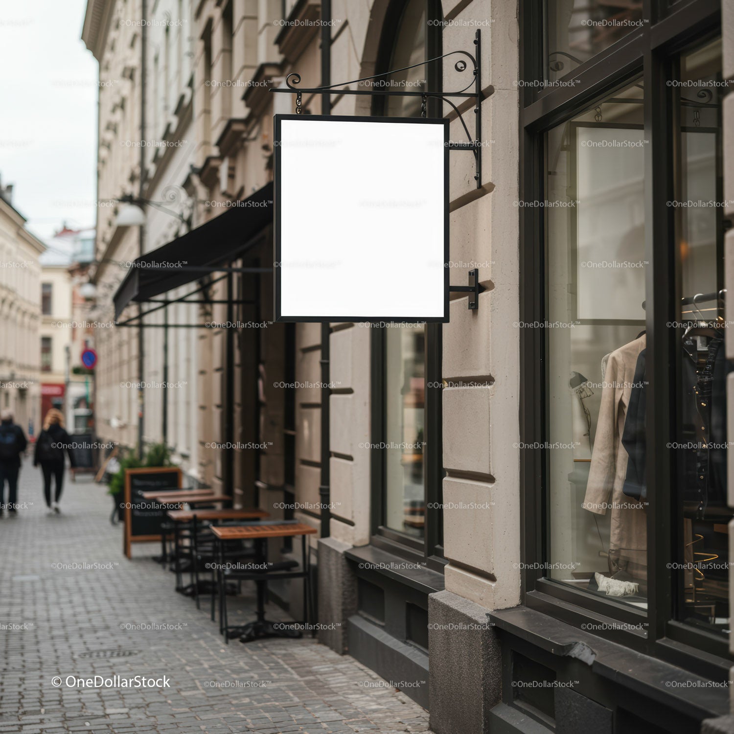 Blank hanging signboard on city street storefront facade